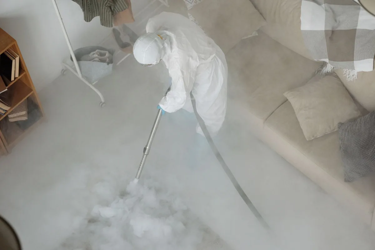 Biohazard cleanup technician in protective equipment, West Chatham, MA